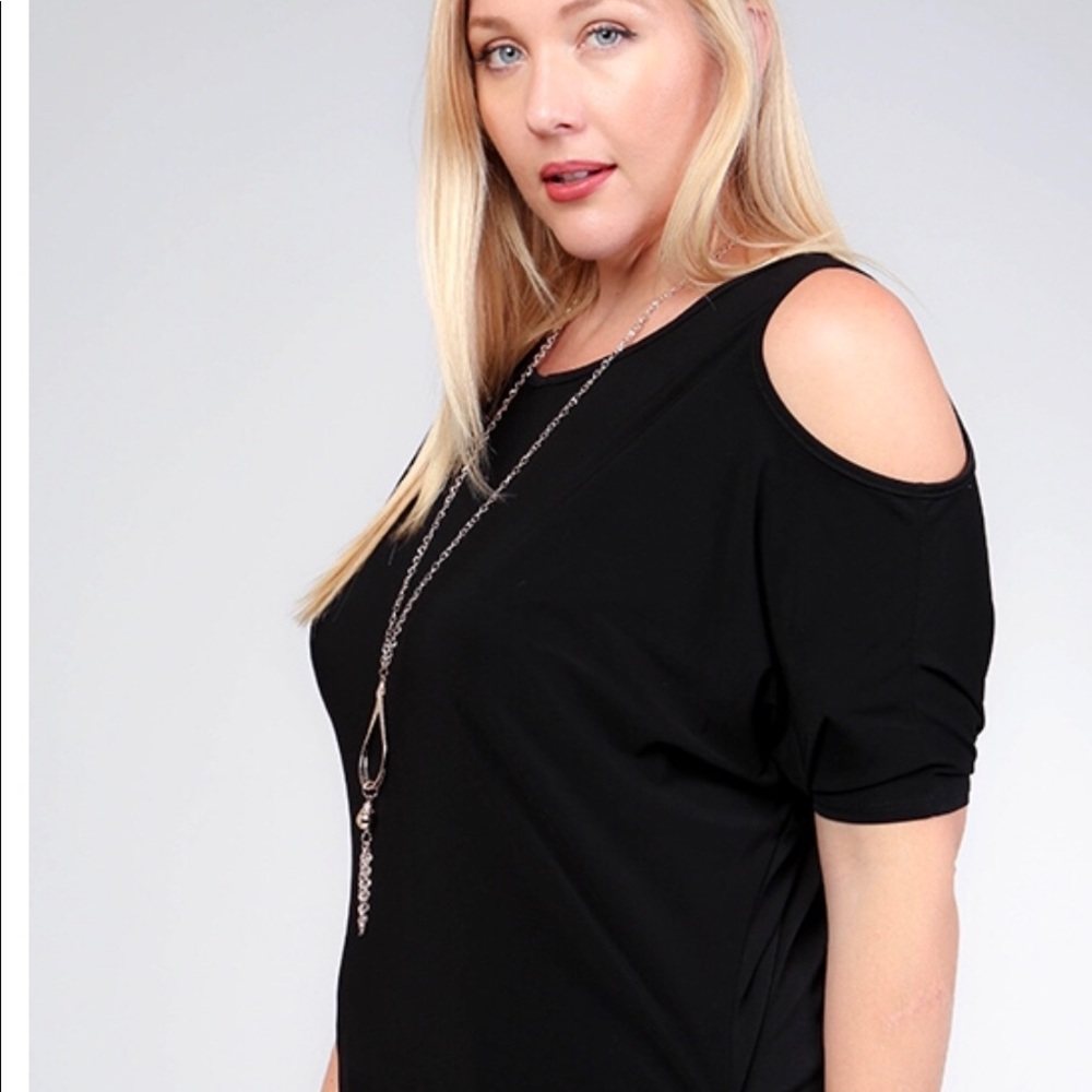 Beautiful plus size black top with necklace.